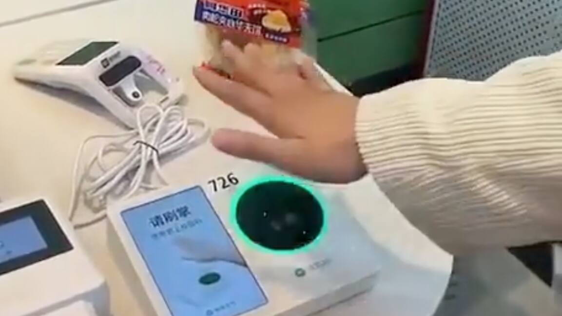 WeChat Pay Chinesen nutzen als Zahlungsmittel ihre Handfläche Blick